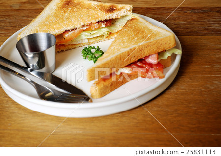 Bacon sandwich with fresh vegetables. Bacon sandwich with fresh vegetables. 25831113