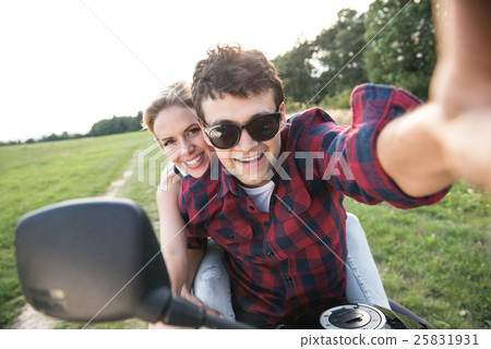 Couple in love enjoying a quad bike ride in Couple in love enjoying a quad bike ride in 25831931