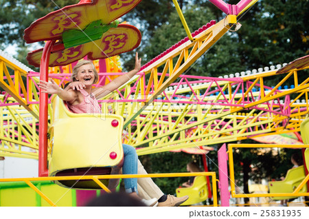 Senior couple in amusement park 25831935