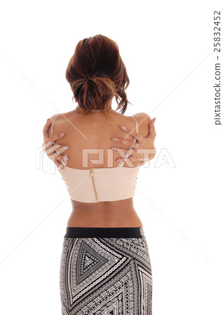Woman hugging herself. 25832452