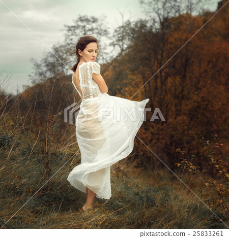 Beautiful girl in a white dress and autumn 25833261