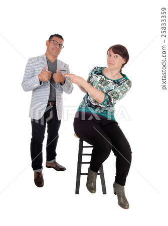Woman pointing finger at her husband. 25833359
