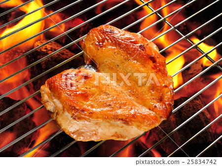 Grilled chicken breast on the flaming grill Grilled chicken breast on the flaming grill 25834742