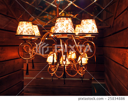 Vintage chandelier with light bulbs.  25834886