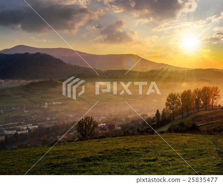 meadow near village in autumn mountains at sunset meadow near village in autumn mountains at sunset 25835477