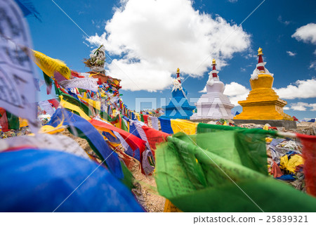 Three buddhist stupa with Buddhist prayer flags 25839321