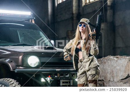 Girl in uniform with weapons in their hands 25839920