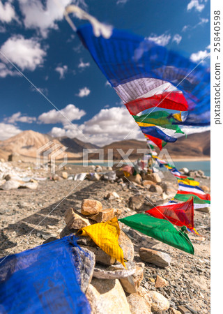 Colorful prayer flags with motion at Pangong Lake Colorful prayer flags with motion at Pangong Lake 25840598