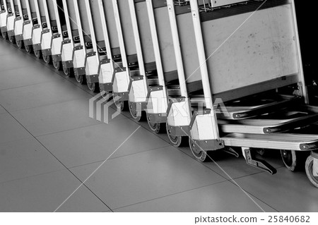 baggage trolleys at airport.  25840682