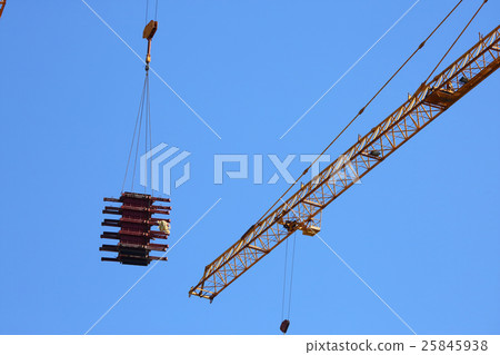 machinery crane hoisting up steel rod bar 25845938