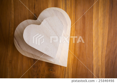 wood box shaped heart on brown wooden background wood box shaped heart on brown wooden background 25846498