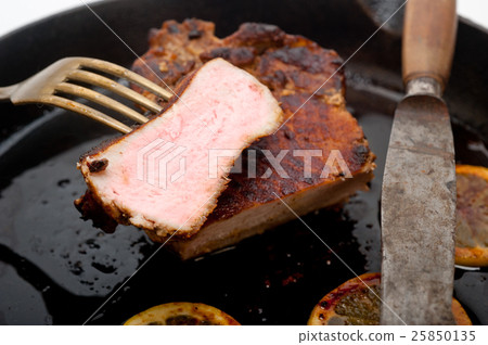 pork chop seared on iron skillet pork chop seared on iron skillet 25850135