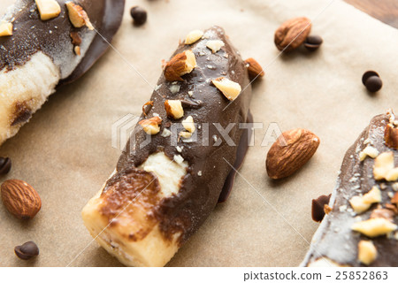 Fresh banana with chocolate and nuts 25852863