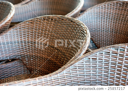 Diagonal lines and rattan armchairs 25857217