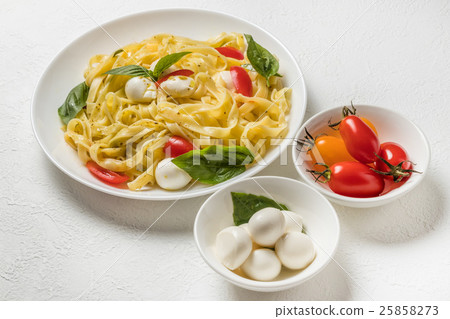 Italian food ingredients raw pasta Raw pasta and Italian ingredients Italian food ingredients raw pasta Raw pasta and Italian ingredients 25858273