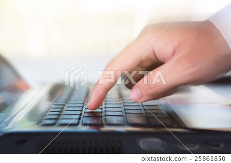finger holding to phone on keyboard 25861850