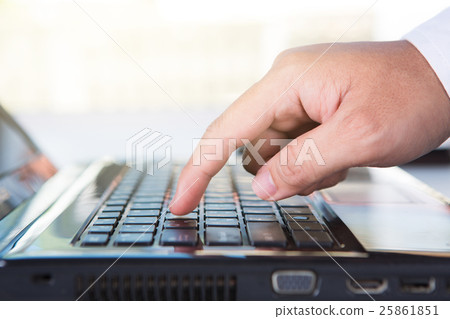 finger holding to phone on keyboard 25861851