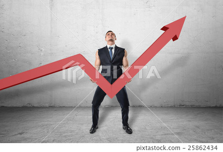 Businessman holding big red line graph with an 25862434