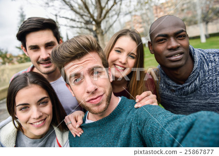 multiracial group of friends taking selfie-圖庫照