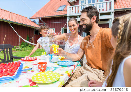 Family drinking coffee and eating cake Family drinking coffee and eating cake 25870948