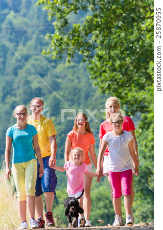 Family having walk on path in the woods Family having walk on path in the woods 25870955