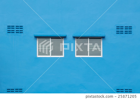 Two windows on the blue wall. Two windows on the blue wall. 25871205