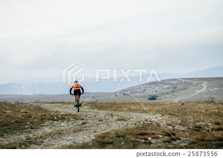 mountainbiker on cycle rides on a mountain trail 25873556