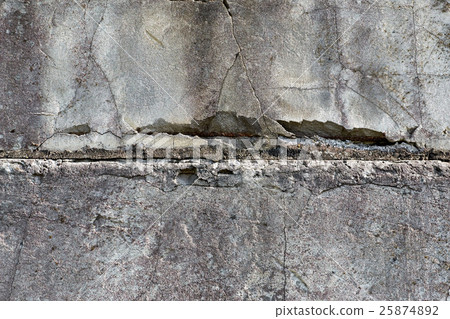 stone fence with metal reinforcement destruction 25874892