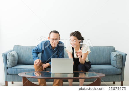 Senior male and young woman (personal computer) 25875675