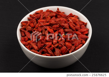 white ceramic bowl with goji berries white ceramic bowl with goji berries 25876625