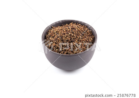 Decorticated cardamom seeds in a bowl 25876778