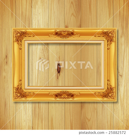 Antique gold frame on wooden wall ; Antique gold frame on wooden wall ; 25882572