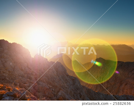 Lens flare light, strong effect. Morning mountains Lens flare light, strong effect. Morning mountains 25882636