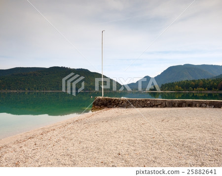 Stony sporty port at mountain lake. End of wharf 25882641