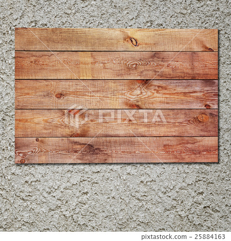 Vintage wooden sign on stucco concrete wall. 25884163
