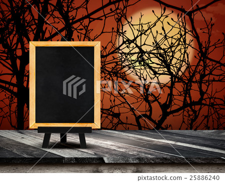 Blackboard with easel on grunge plank wooden table Blackboard with easel on grunge plank wooden table 25886240