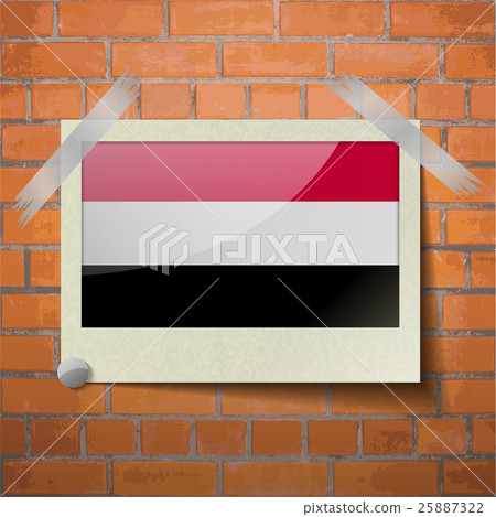 Flags Yemen scotch taped to a red brick wall 25887322