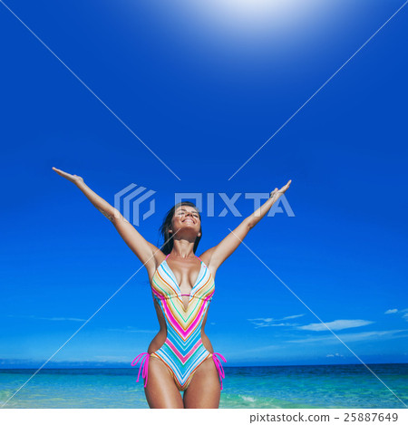 Happy woman on beach Happy woman on beach 25887649