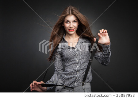 Happy woman pulling suspenders. Happy woman pulling suspenders. 25887958