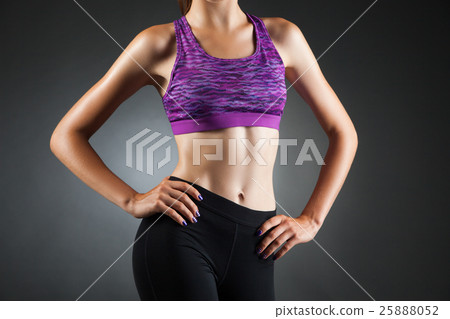 Fit anonymous girl akimbo. 25888052