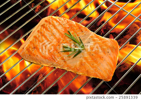 Grilled salmon on the flaming grill Grilled salmon on the flaming grill 25891339
