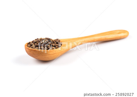 Decorticated cardamom seeds in a wooden spoon Decorticated cardamom seeds in a wooden spoon 25892027