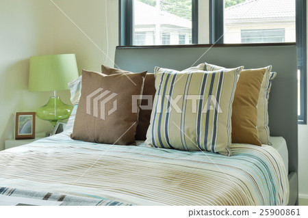 Striped bedding in modern decorated bedroom Striped bedding in modern decorated bedroom 25900861