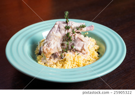 Stewed rabbit meat in creamy sauce with herbs and Stewed rabbit meat in creamy sauce with herbs and 25905322