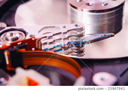 Internal hard disk closeup on wooden background 25907841