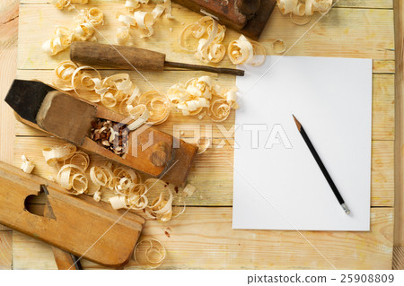 White sheet on wooden table for carpenter tools White sheet on wooden table for carpenter tools 25908809