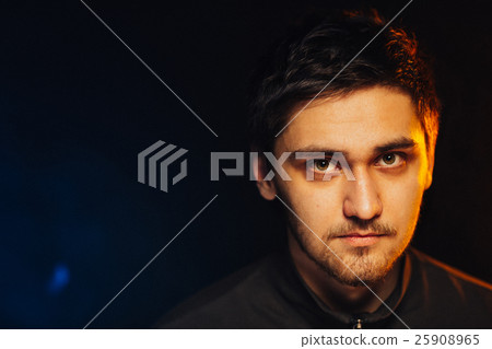 portrait of a young brutal man on black background portrait of a young brutal man on black background 25908965