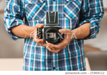 Old film professional photo camera close-up 25909112