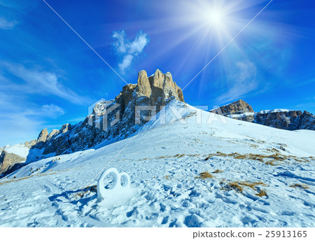 Wedding ring from the snow on mountainside. 25913165