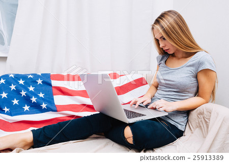 Pretty female with long hair using laptop Pretty female with long hair using laptop 25913389
